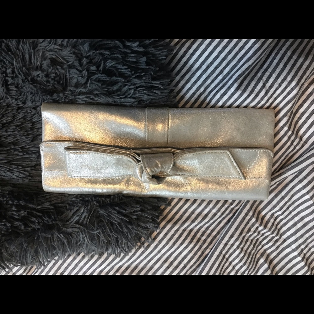 Silver leather clutch with bow detail